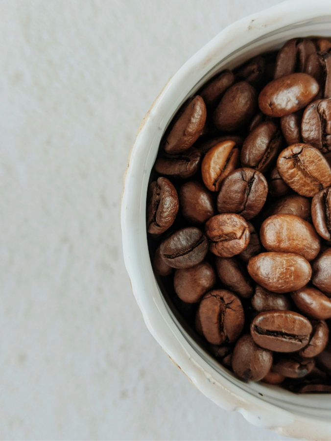Image of coffee beans in a cup for the What is an ethical coffee Coffeelink blog.